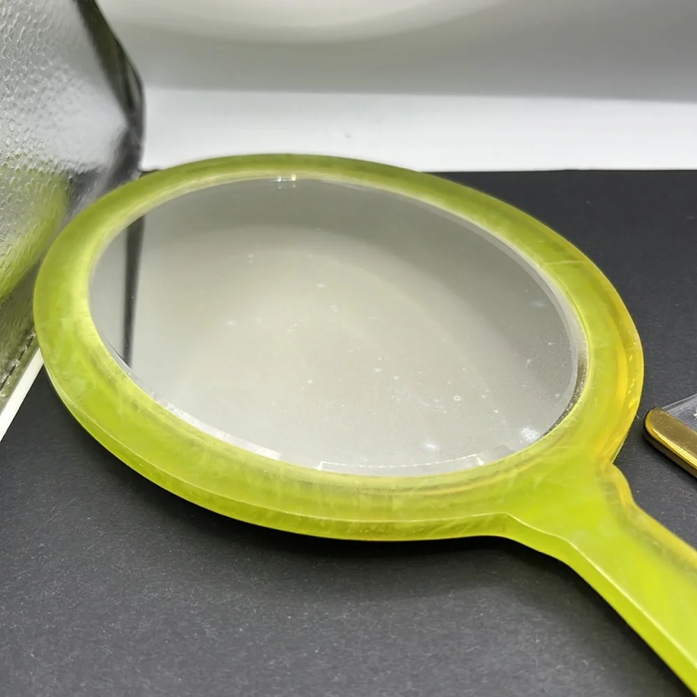 Vintage green celluloid hand mirror and comb set